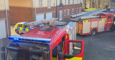 Firefighters rush to flats blaze in Bolton after kitchen fills room with smoke