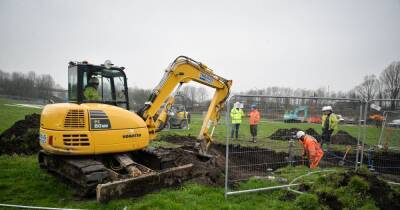 Burst water mains causes 'huge sink hole' in field