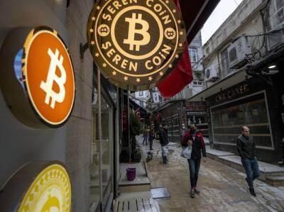 Bitcoin holds ground after touching its highest this year amid Ukraine war