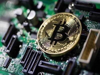Buoyant bitcoin helps crypto market surge past $2 trillion barrier