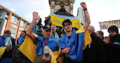 Emotional moment Ukrainian man completes 45-mile run for family back home as protesters cheer in Piccadilly Gardens
