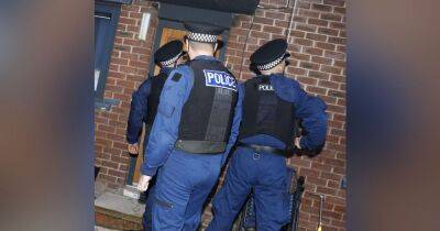 GMP arrest 30 after officers storm homes in dawn raids across Salford
