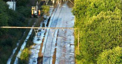 Trains cancelled and lines closed after thousands of gallons of water submerges tracks